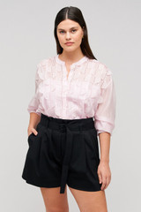 Profile view of model wearing the Oroton Scallop Lace Overshirt in Pink Rose and 85% Tencel 15% Polyester for Women