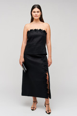 Profile view of model wearing the Oroton Rosebud Lace Skirt in Black and 100% linen material for Women . IP:8