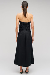 Profile view of model wearing the Oroton Rosebud Lace Skirt in Black and 100% linen material for Women . IP:5