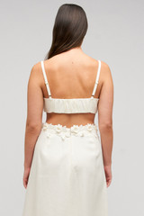 Profile view of model wearing the Oroton Rosebud Lace Bralet in Soft Cream and 100% linen material for Women . IP:11