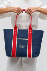 Profile view of model wearing the Oroton Crew Tote in Prussian Blue Mix and Canvas material for Women