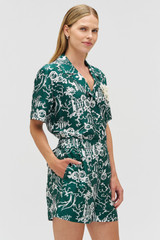 Profile view of model wearing the Oroton Garden Toile Print Short in Ivy and 100% silk for Women . IP:5