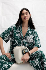 Profile view of model wearing the Oroton Garden Toile Embellished Camp Shirt in Ivy and 100% silk for Women . IP:2