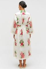 Profile view of model wearing the Oroton Verandah Floral Long Tunic Dress in Multi and 100% Linen for Women