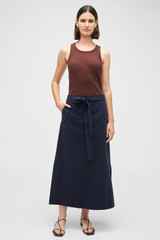 Profile view of model wearing the Oroton Clover Poplin Skirt in North Sea and 100% Cotton for Women
