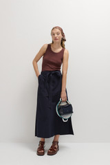 Profile view of model wearing the Oroton Clover Poplin Skirt in North Sea and 100% Cotton for Women