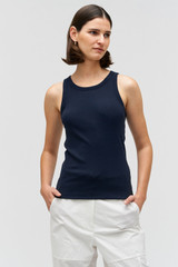 Profile view of model wearing the Oroton Lottie Rib Tank in North Sea and 92% Cotton / 8% Spandex for Women . IP:3
