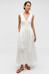 Profile view of model wearing the Oroton Lace Trim Apron Dress in White and 100% Linen for Women