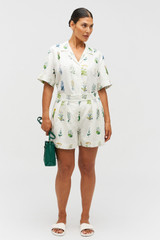 Profile view of model wearing the Oroton Greenhouse Floral Camp Shirt in Mist and 100% Linen for Women .