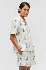 Profile view of model wearing the Oroton Greenhouse Floral Camp Shirt in Mist and 100% Linen for Women . IP:4