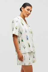 Profile view of model wearing the Oroton Greenhouse Floral Camp Shirt in Mist and 100% Linen for Women . IP:10