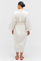 Profile view of model wearing the Oroton Table Cloth Lace Column Dress in Soft Cream and 48% Cotton 52% Hemp for Women