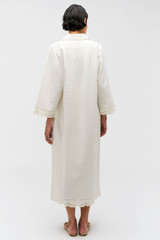 Profile view of model wearing the Oroton Table Cloth Lace Column Dress in Soft Cream and 48% Cotton 52% Hemp for Women