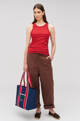 Profile view of model wearing the Oroton Lottie Rib Tank in Market Red and 92% Cotton / 8% Spandex for Women