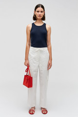 Profile view of model wearing the Oroton Scout Poplin Cargo Pant in White and 100% Cotton for Women