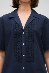 Profile view of model wearing the Oroton Posy Ruffle Camp Shirt in North Sea and 100% Cotton for Women . IP:6