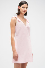 Profile view of model wearing the Oroton Tie Shoulder A-Line Dress in Palest Pink and 100% cotton fabric for Women . IP:4
