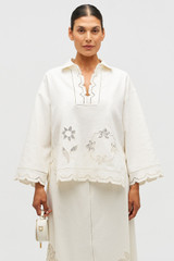 Profile view of model wearing the Oroton Table Cloth Lace Top in Soft Cream and 48% Cotton 52% Hemp for Women