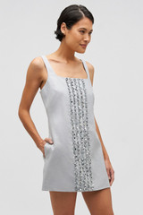 Profile view of model wearing the Oroton Mini Sequin Flower Shift Dress in Oyster and 100% linen for Women . IP:4