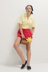 Profile view of model wearing the Oroton Posy Ruffle Camp Shirt in Lemon and 100% Cotton Poplin for Women