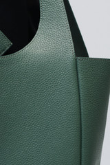 Profile view of model wearing the Oroton Emilia Tote in Mineral and Pebble leather exterior for Women