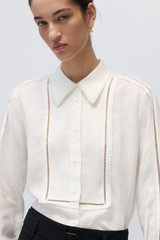 Profile view of model wearing the Oroton Lace Detail Long-Sleeve Shirt in White and 100% Linen for Women . IP:6