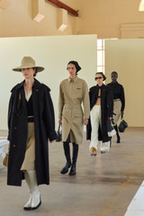 Profile view of model wearing the Oroton Belt Detail Trouser Skirt in Camel and 100% cotton material for Women . IP:2