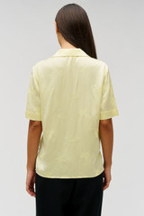 Profile view of model wearing the Oroton Embroidered Leaf Short Sleeve Camp Shirt in Lemon and 100% viscose fabric for Women . IP:5