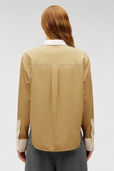 Profile view of model wearing the Oroton Crisp Poplin Shirt in SOFT CAMEL and 100% cotton fabric for Women .
