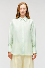 Profile view of model wearing the Oroton Ls Silk Shirt in Sea Mist and 100% silk dupion fabric with a subtle horizontal slub texture for Women . IP:3