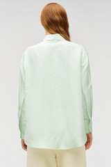 Profile view of model wearing the Oroton Ls Silk Shirt in Sea Mist and 100% silk dupion fabric with a subtle horizontal slub texture for Women . IP:5