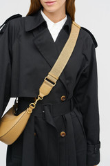 Profile view of model wearing the Oroton Logo Bag Strap in DARK TAUPE and Premium leather and webbing material for Women . IP:2