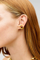 Profile view of model wearing the Oroton Wave Studs in WORN GOLD/CHERRY and Premium brass material for Women .