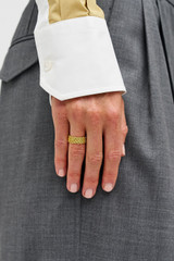 Profile view of model wearing the Oroton Mathilde Ring in Worn Gold and Premium brass material for Women . IP:2