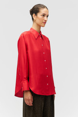 Profile view of model wearing the Oroton Ls Silk Shirt in Poppy and 100% silk dupion fabric with a subtle horizontal slub texture for Women . IP:4