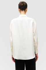 Profile view of model wearing the Oroton Ls Silk Shirt in Cream and 100% silk dupion fabric with a subtle horizontal slub texture for Women . IP:5