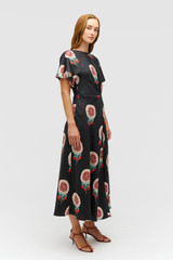 Profile view of model wearing the Oroton WINTER FLORAL DRESS in Black and 100% silk fabric for Women