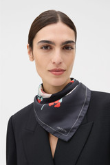 Profile view of model wearing the Oroton Winter Floral Silk Scarf 70X70 in Black and 100% silk twill fabric for Women . IP:2