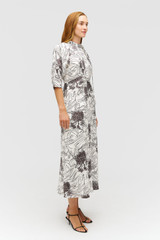 Profile view of model wearing the Oroton Scribble Tree Tie Neck Dress in Cream and 100% silk fabric for Women . IP:3