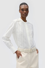 Profile view of model wearing the Oroton TEXTURED STRIPE BLOUSE in Antique White and 100% cotton fabric for Women