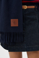 Profile view of model wearing the Oroton WOVEN WOOL SCARF in North Sea and 100% wool fabric for Women