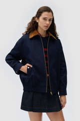 Profile view of model wearing the Oroton Contrast Collar Bomber in North Sea and 100% cotton fabric for Women . IP:4