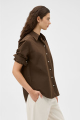 Profile view of model wearing the Oroton Wren Poplin Shirt in Dark Chocolate and 100% cotton fabric for Women . IP:4