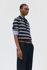 Profile view of model wearing the Oroton FLORA FINE KNIT STRIPE POLO in North Sea and 55% extra fine merino wool and 45% cotton blend fabric for Women . IP:4
