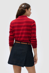 Profile view of model wearing the Oroton FLORA FINE KNIT STRIPE POLO in Rouge and 55% extra fine merino wool and 45% cotton blend fabric for Women