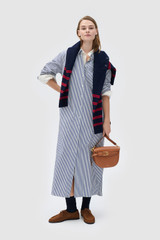 Profile view of model wearing the Oroton WREN STRIPE DRESS in North Sea and 100% yarn-dyed cotton fabric for Women