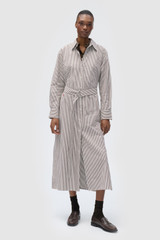 Profile view of model wearing the  WREN STRIPE DRESS in Dark Chocolate and 100% yarn-dyed cotton fabric for Women