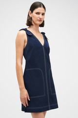 Profile view of model wearing the Oroton Tie Shoulder A-Line Dress in North Sea and 100% Cotton for Women