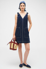 Profile view of model wearing the Oroton Tie Shoulder A-Line Dress in North Sea and 100% Cotton for Women