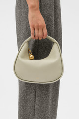 Profile view of model wearing the Oroton Clara Mini Bag in FUDGE and  for Women . IP:2